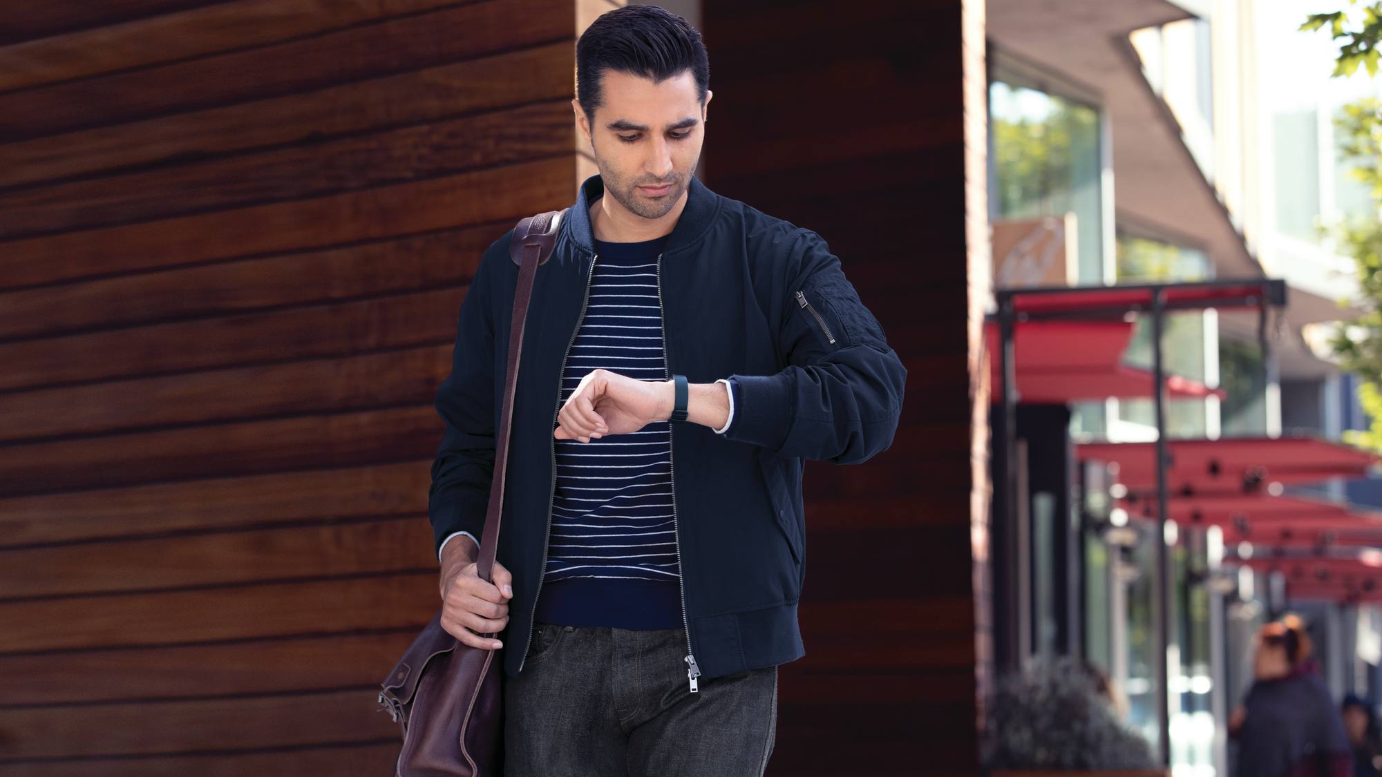 Fitbit Inspire 2 Lifestyle Street Man Walking Midnight Leather 07056, EntrepreNerd