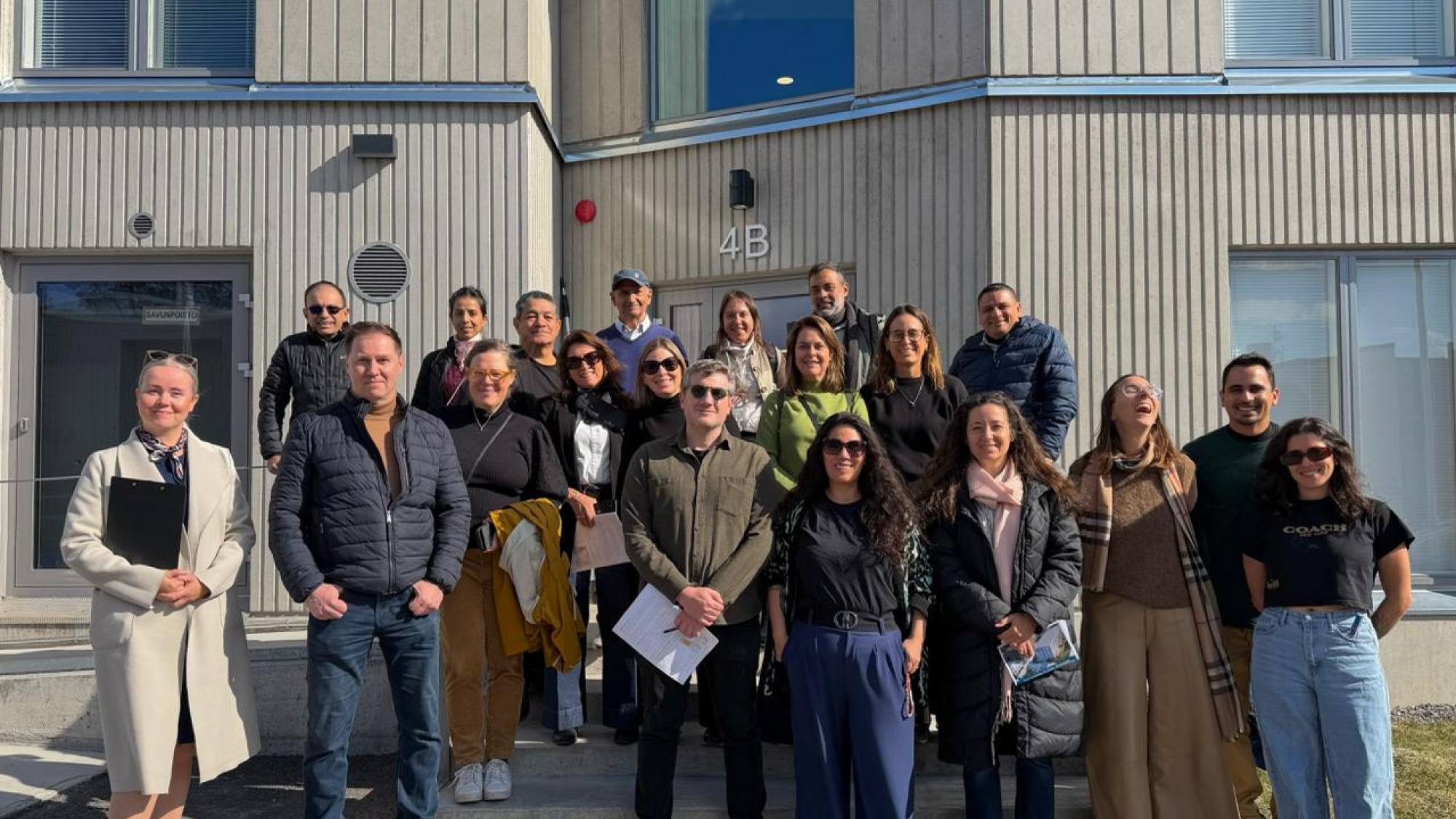 Group photo from the visit to TVT Asunnot Oy’s Hirvensalo comparison project together with Kati Leppiaho. The site presented a project comparing the environmental impacts, energy efficiency, and living experience of wooden and concrete apartment buildings, Niina Fu